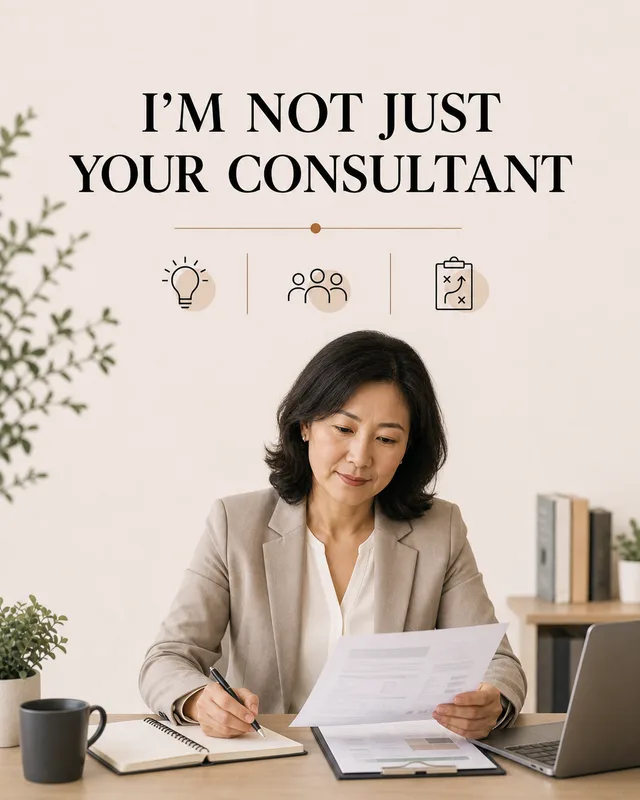 LinkedIn graphic reading “I’M NOT JUST
YOUR CONSULTANT” over a woman in a beige blazer reviewing documents at her office desk